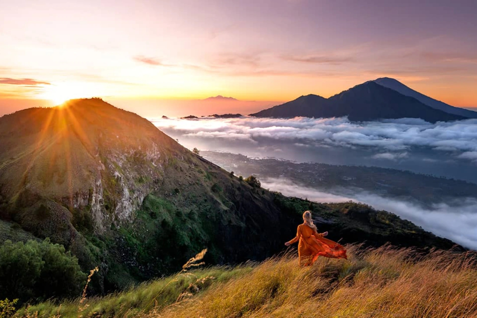 Local guide assisting hikers during the Mount Batur Sunrise Trekking tour.